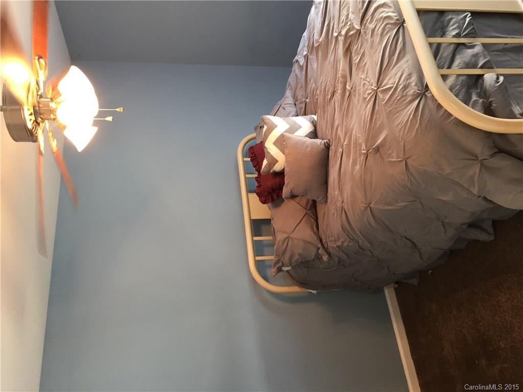3937 Caliper Place, Unit 337 Fort Mill, SC 29708 - Photo 14 of 20 a bed sitting in a bedroom next to a window