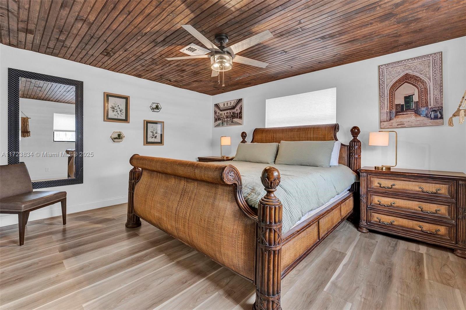 1111 Brown Road Lake Worth, FL 33462 - Photo 19 of 63 a bed room with a bed and a dresser