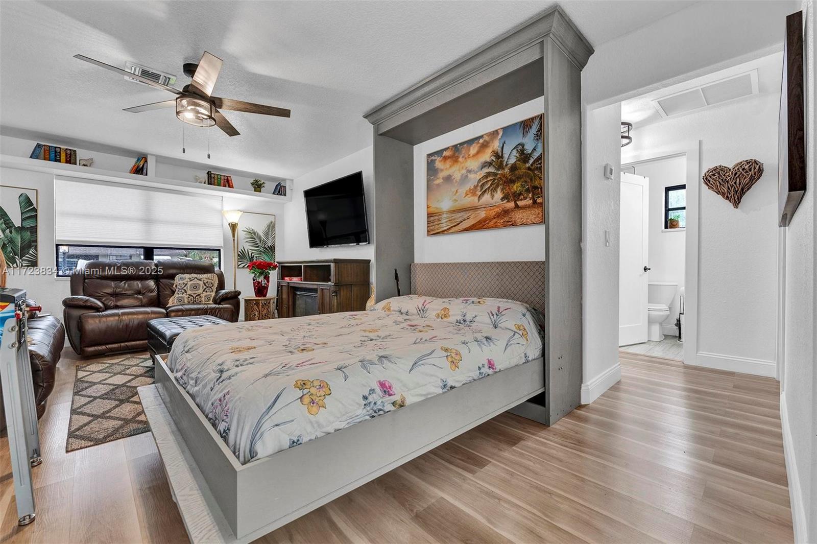 1111 Brown Road Lake Worth, FL 33462 - Photo 23 of 63 a bedroom with a bed a couch and dresser