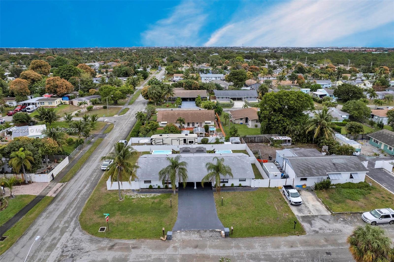 1111 Brown Road Lake Worth, FL 33462 - Photo 3 of 63 an aerial view of a house with a garden