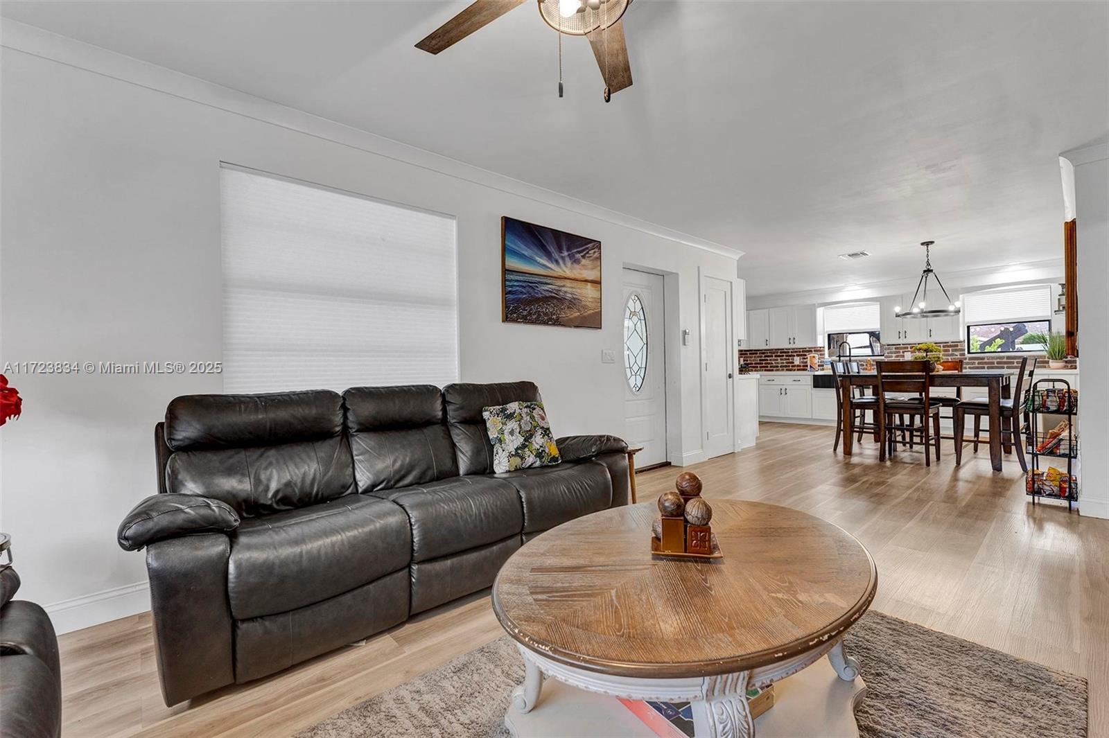 1111 Brown Road Lake Worth, FL 33462 - Photo 34 of 63 a living room with furniture and kitchen view
