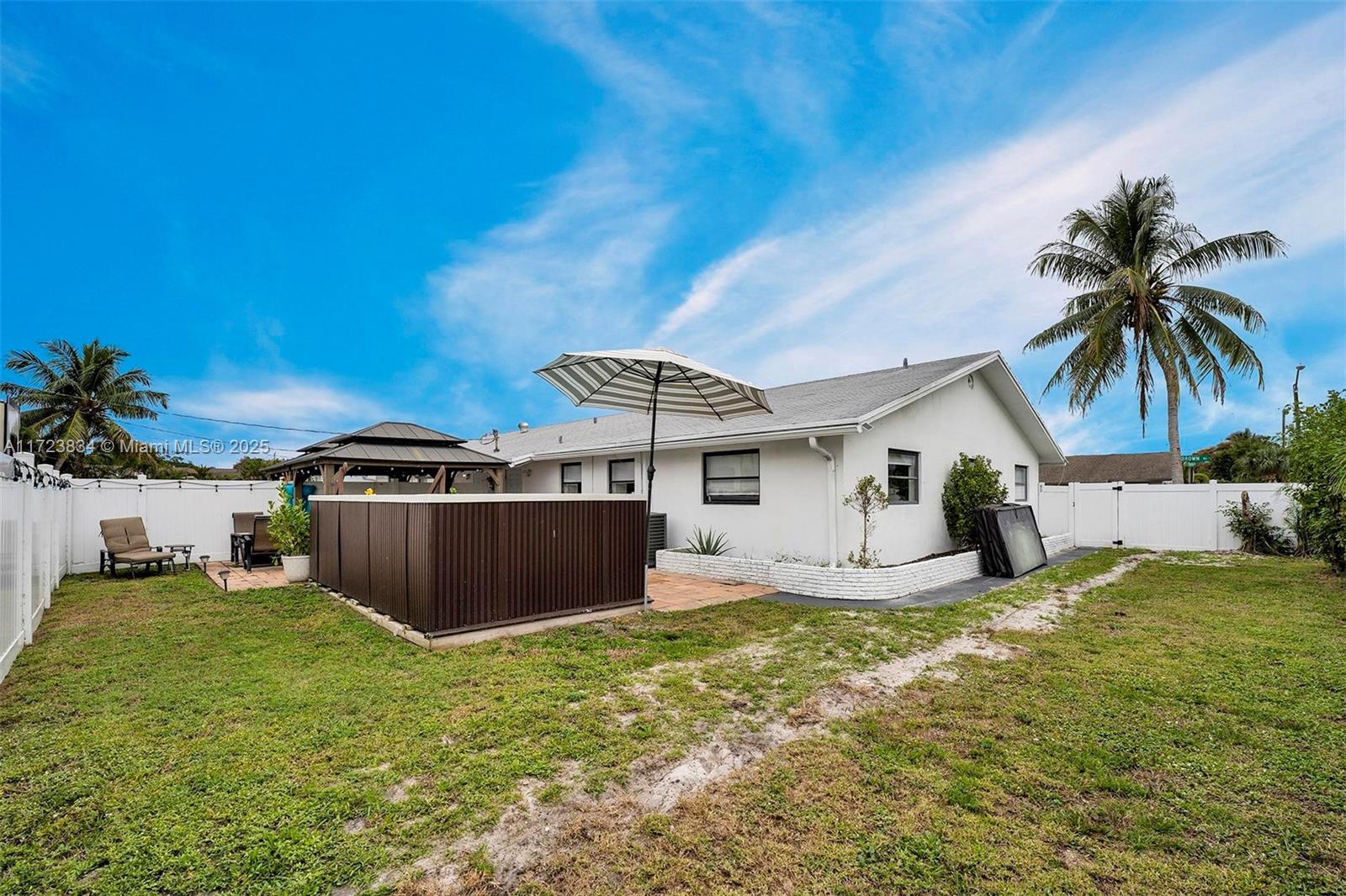 1111 Brown Road Lake Worth, FL 33462 - Photo 41 of 63 a view of a house with backyard and sitting area