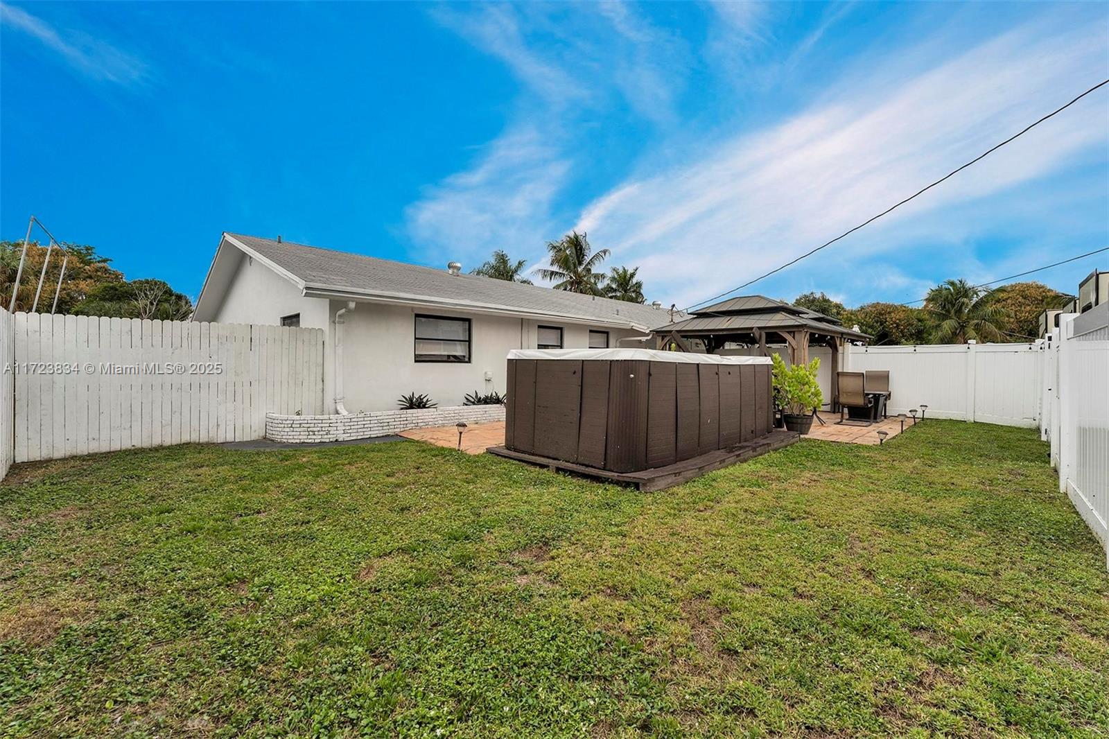 1111 Brown Road Lake Worth, FL 33462 - Photo 47 of 63 a view of a backyard with a garden