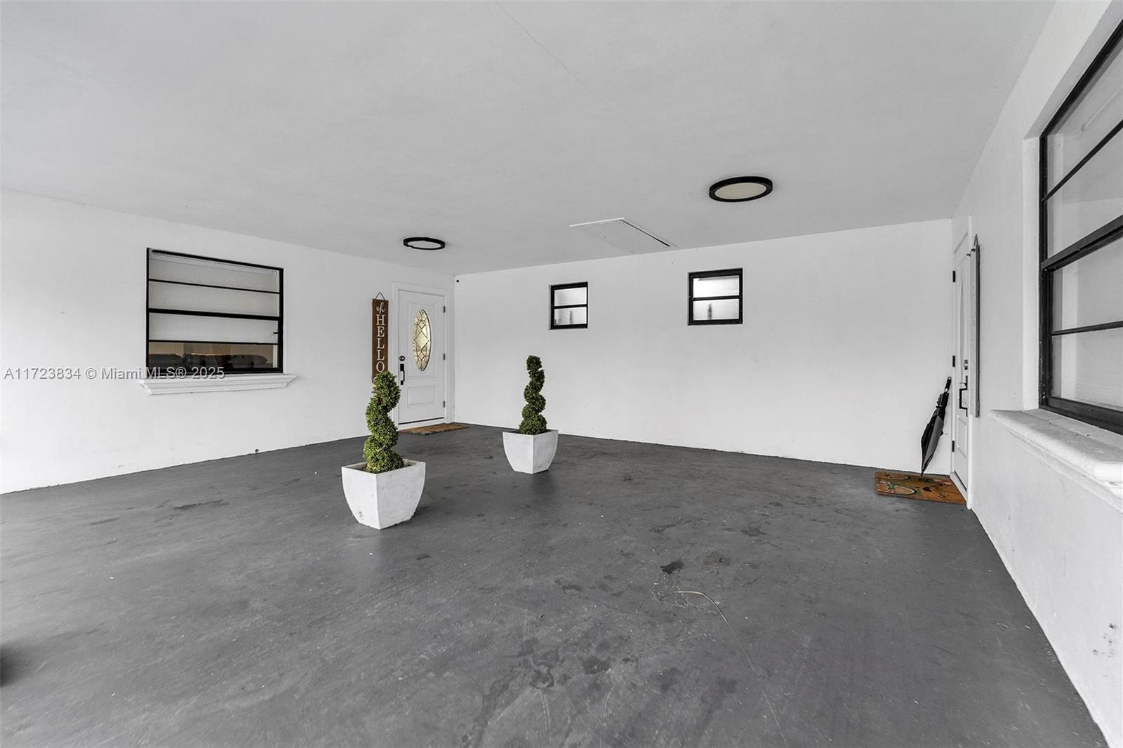 1111 Brown Road Lake Worth, FL 33462 - Photo 7 of 63 a view of a room with wooden floor and window