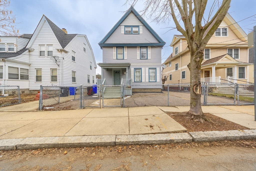 31 Seattle Street, Unit 1 Boston, MA 02134 - Photo 1 of 31 a front view of a house with a yard
