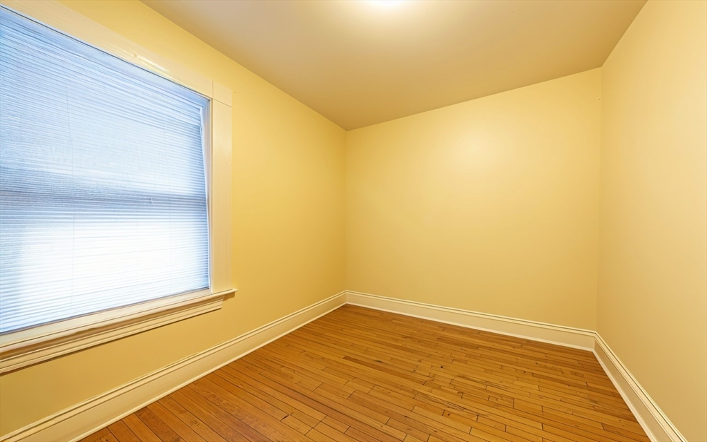 31 Seattle Street, Unit 1 Boston, MA 02134 - Photo 18 of 31 a view of empty room with wooden floor