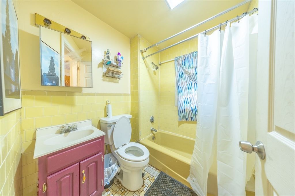 31 Seattle Street, Unit 1 Boston, MA 02134 - Photo 27 of 31 a bathroom with a toilet a sink and a shower