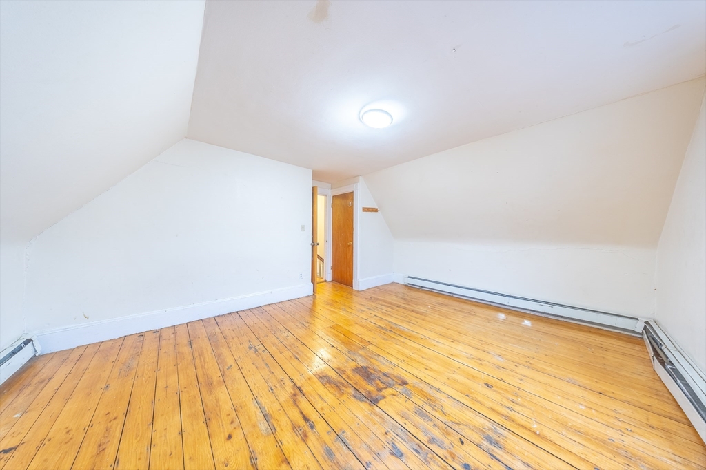 31 Seattle Street, Unit 1 Boston, MA 02134 - Photo 29 of 31 a view of empty room with wooden floor