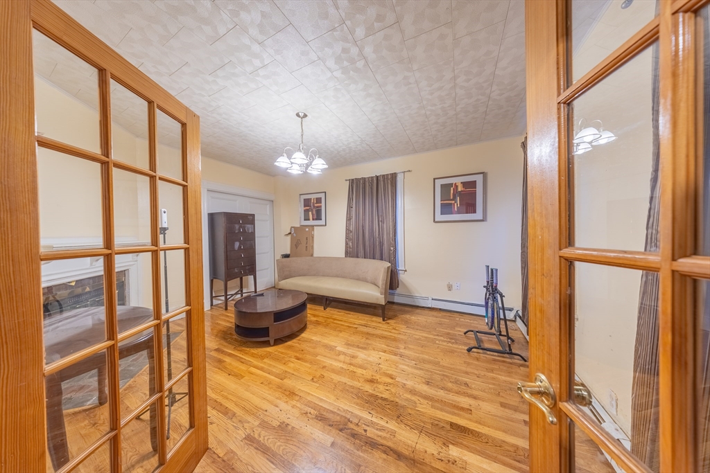 31 Seattle Street, Unit 1 Boston, MA 02134 - Photo 7 of 31 a bedroom with furniture and a window
