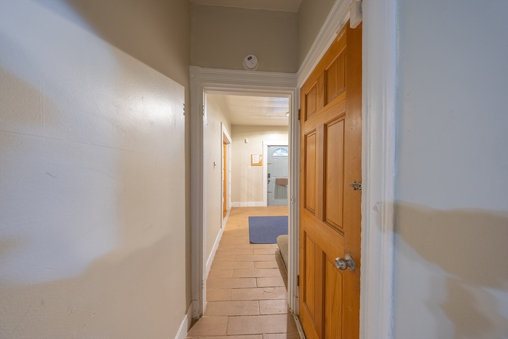 31 Seattle Street, Unit 1 Boston, MA 02134 - Photo 9 of 31 a view of a hallway with a livingroom and a bathroom with sink