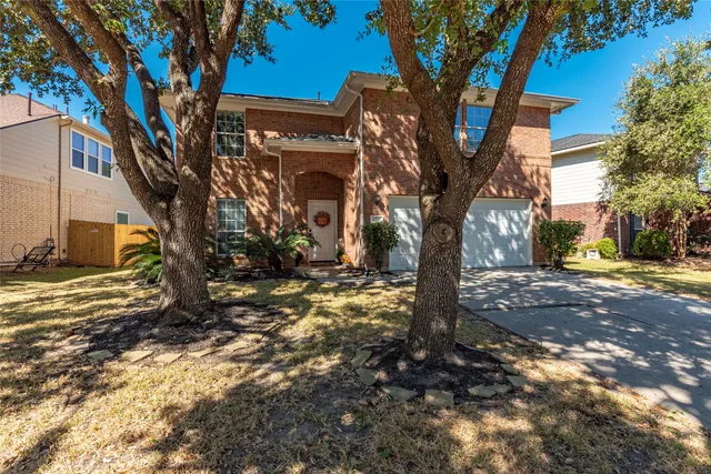 a view of a house with a tree