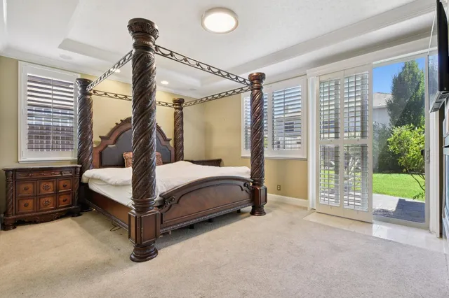 a bedroom with a bed and a mirror