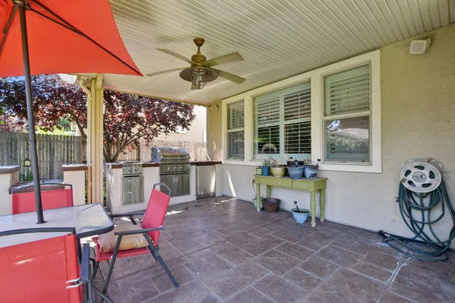 a living room with patio furniture and a window