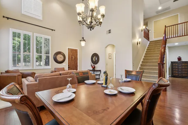 a dining room with furniture and a window