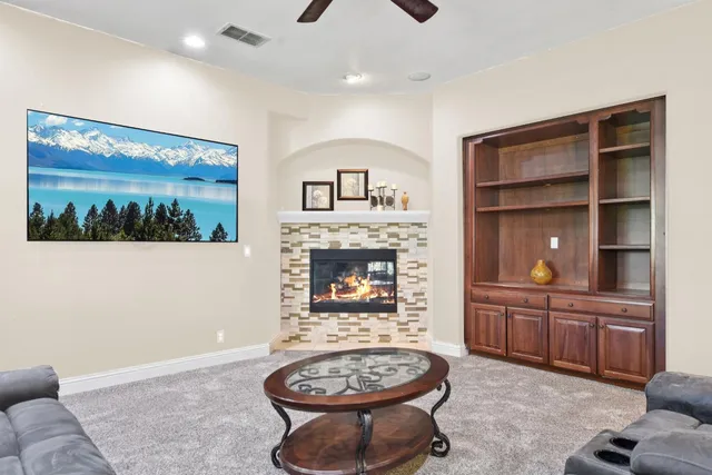 a view of a livingroom with furniture and a fireplace
