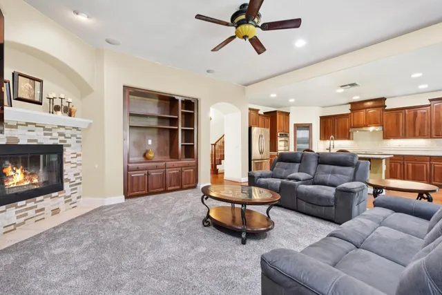 a living room with furniture and a fireplace