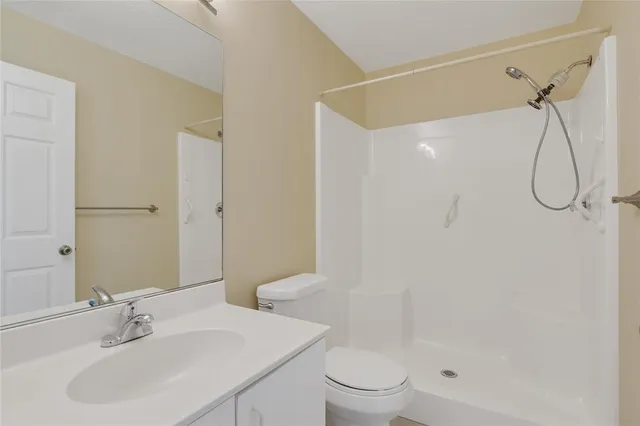 a view of an empty room with a large window