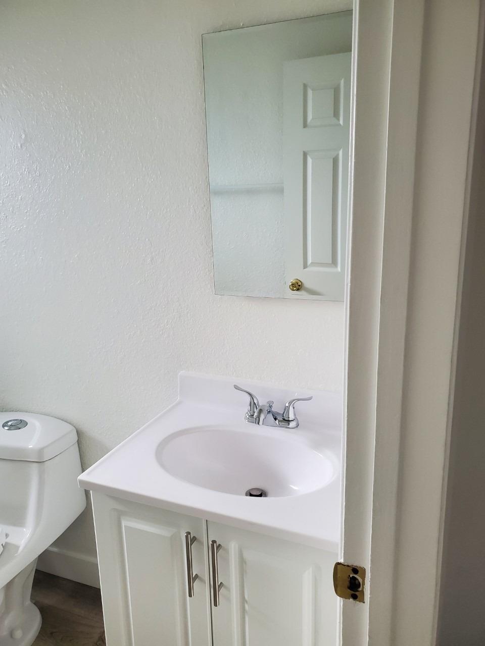 6012-6014 Bourbon Drive Carmichael, CA 95608 - Photo 11 of 30 a bathroom with a sink and toilet