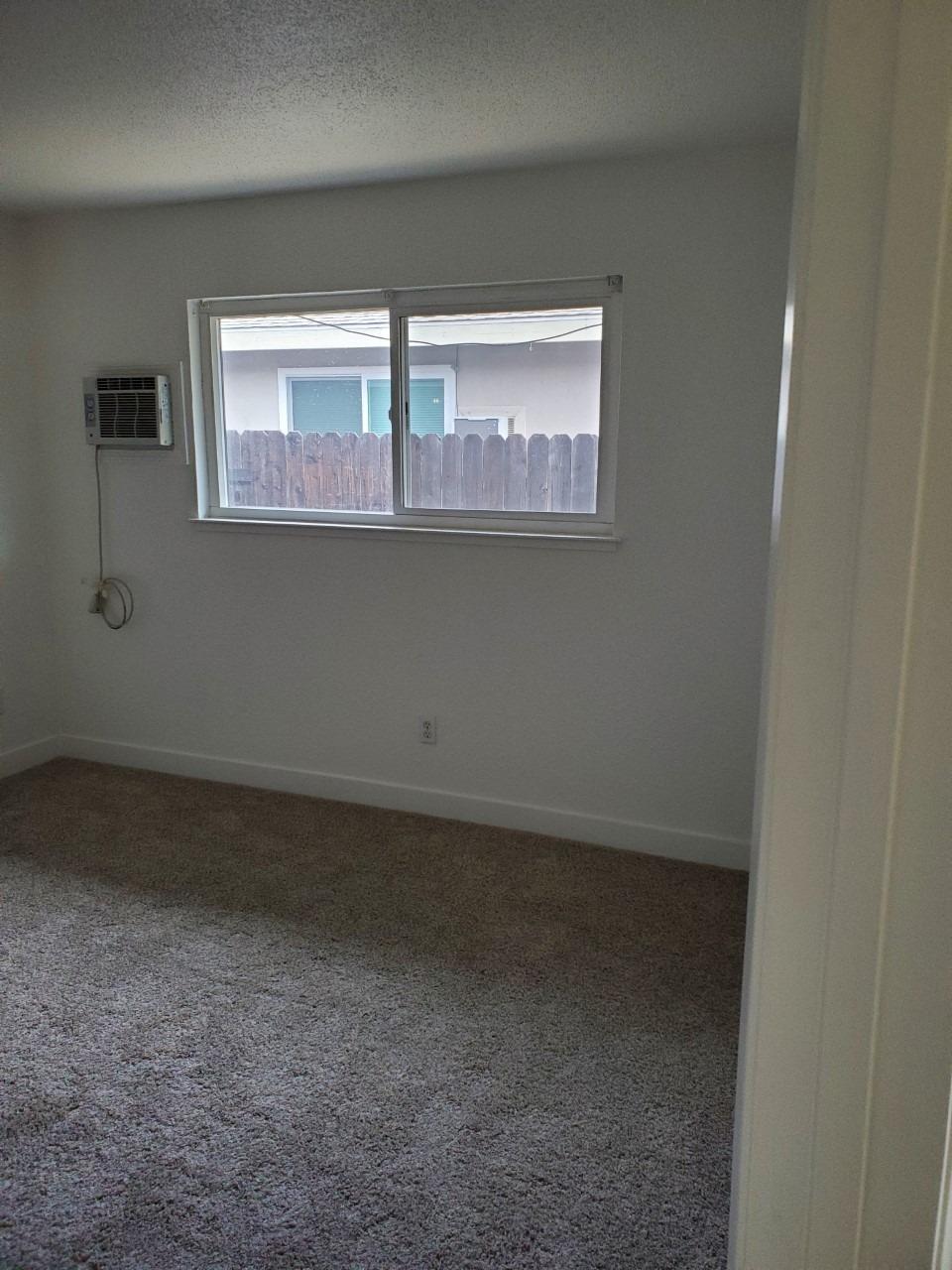 6012-6014 Bourbon Drive Carmichael, CA 95608 - Photo 13 of 30 a view of empty room with window