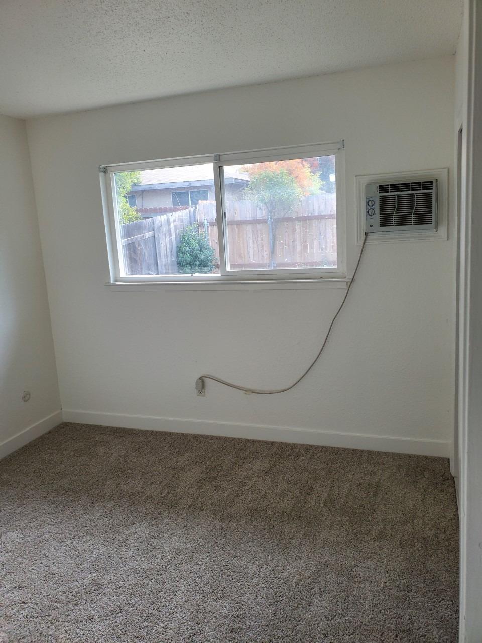 6012-6014 Bourbon Drive Carmichael, CA 95608 - Photo 15 of 30 an empty room with a window
