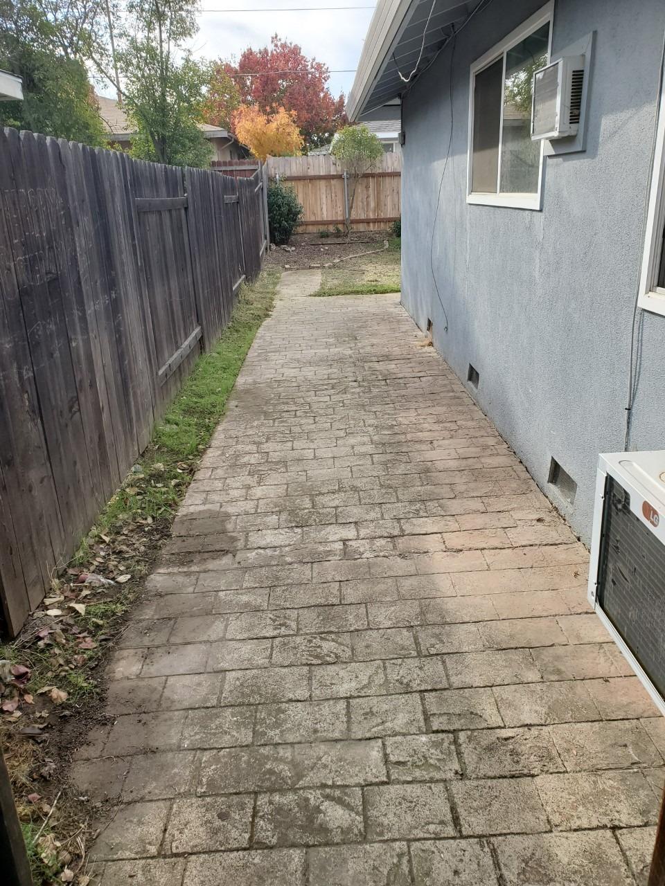 6012-6014 Bourbon Drive Carmichael, CA 95608 - Photo 16 of 30 a view of a backyard with wooden fence