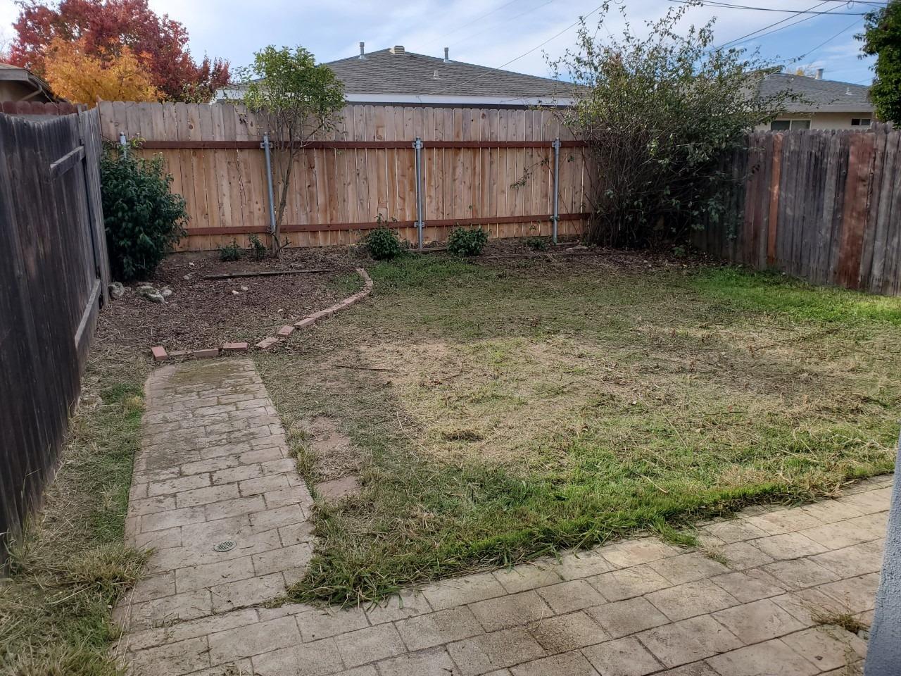 6012-6014 Bourbon Drive Carmichael, CA 95608 - Photo 17 of 30 a backyard of a house