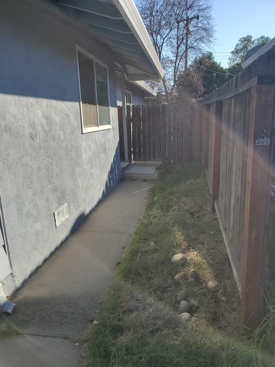 6012-6014 Bourbon Drive Carmichael, CA 95608 - Photo 19 of 30 a view of a backyard