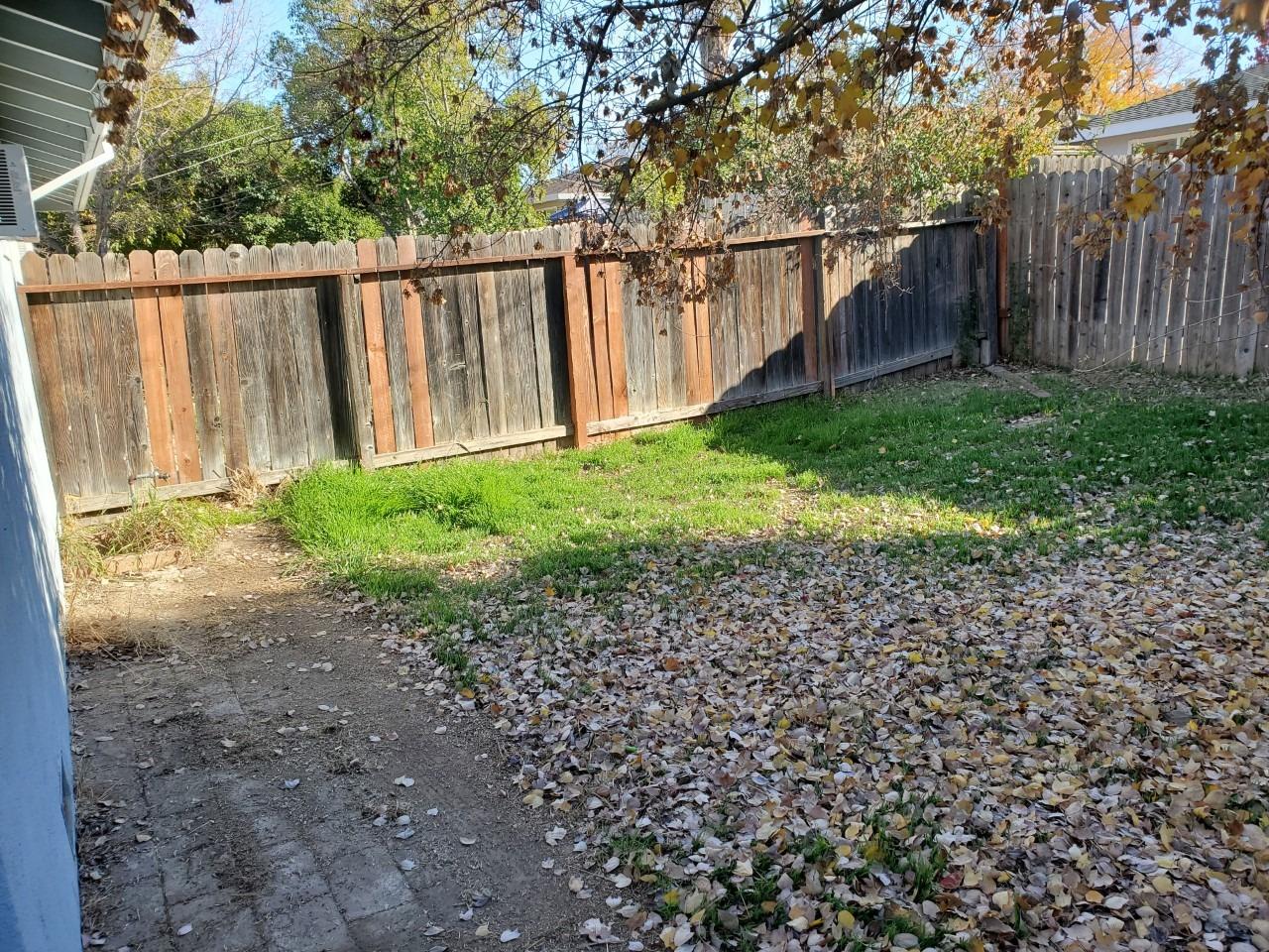 6012-6014 Bourbon Drive Carmichael, CA 95608 - Photo 22 of 30 a view of backyard with wooden fence