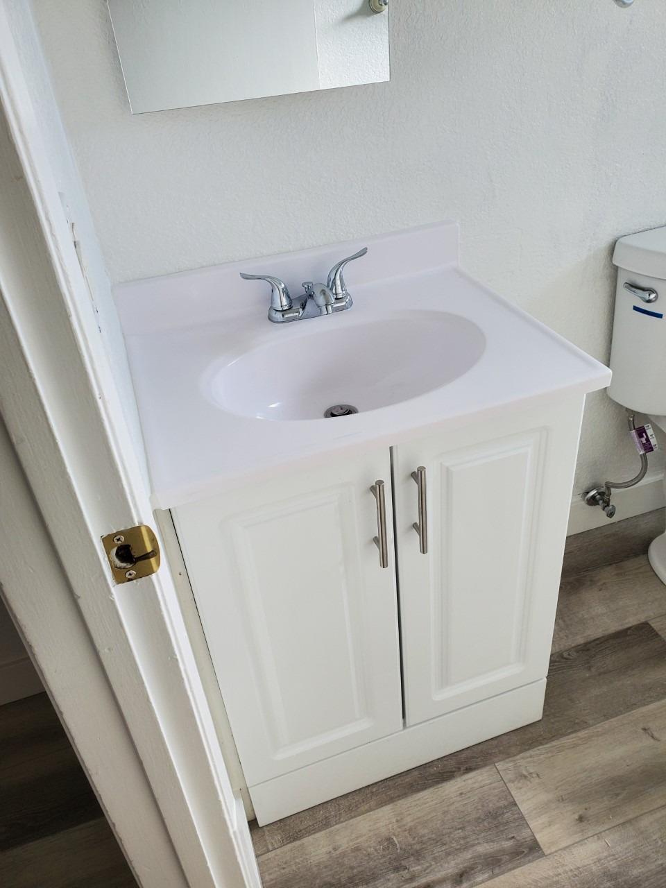 6012-6014 Bourbon Drive Carmichael, CA 95608 - Photo 27 of 30 a bathroom with a sink and toilet