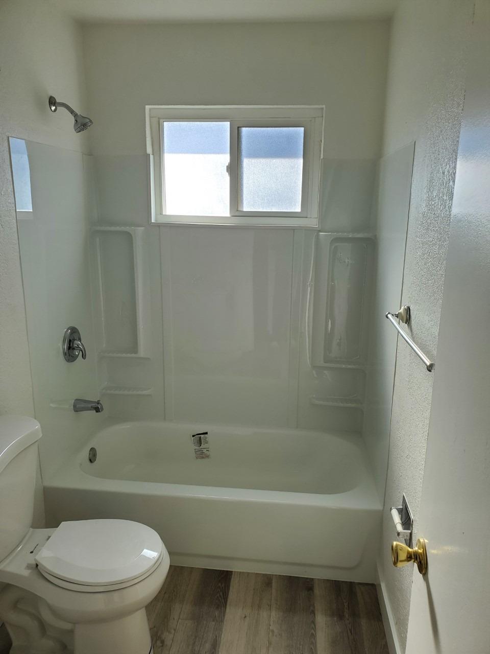 6012-6014 Bourbon Drive Carmichael, CA 95608 - Photo 28 of 30 a bathroom with a toilet and a bath tub