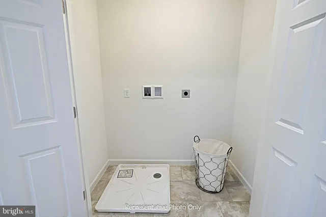 a bathroom with a sink a toilet and a large mirror