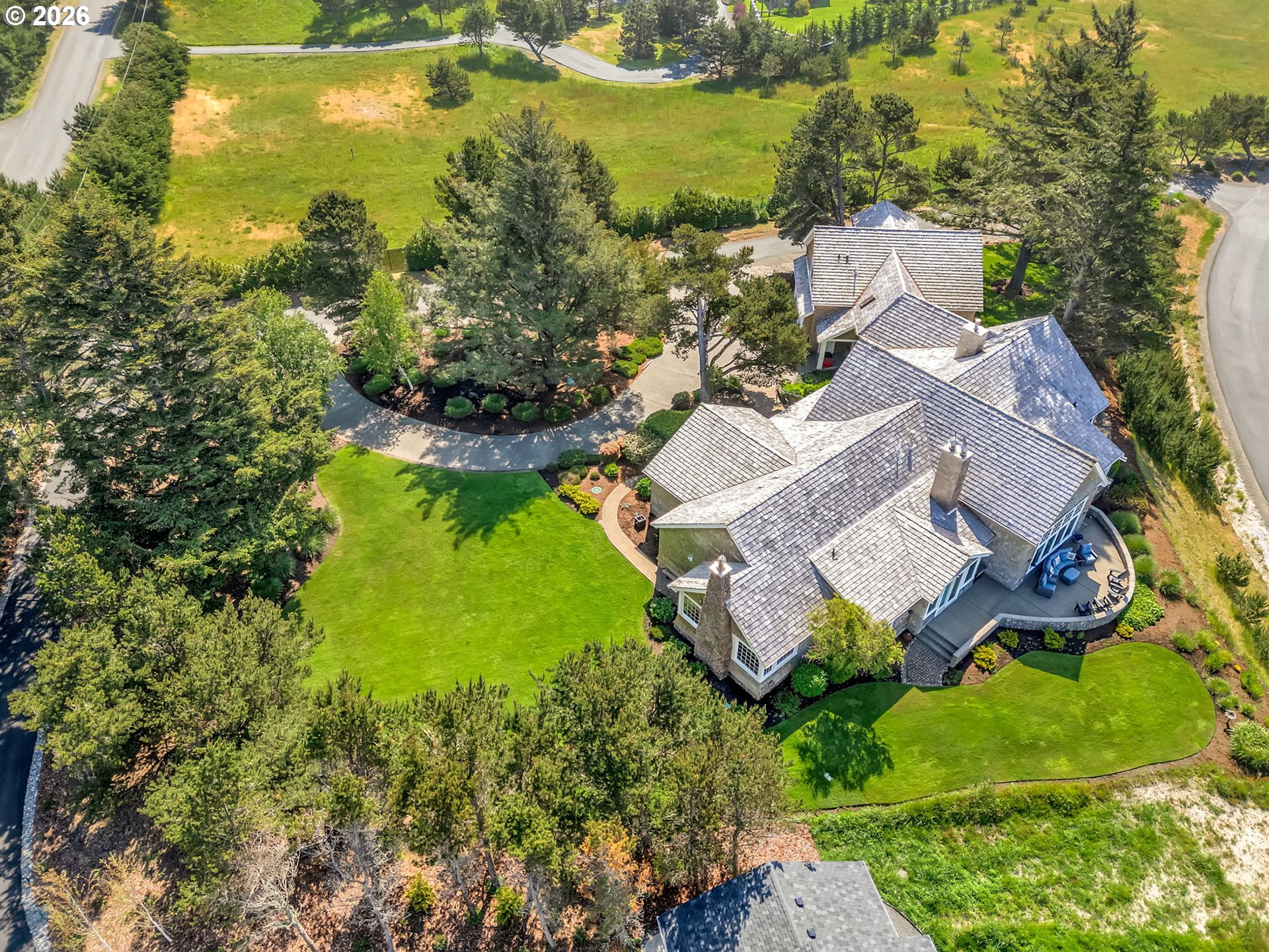 89079 Pinehurst Road Warrenton, OR 97146 - Photo 5 of 46 an aerial view of residential houses with outdoor space and swimming pool
