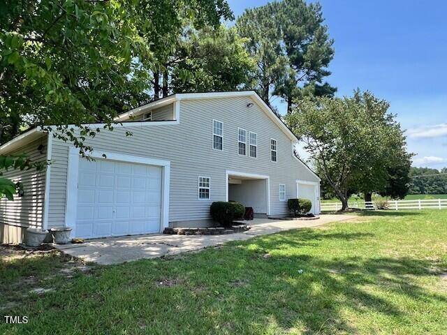 9816 Debnam Road Zebulon, NC 27597 - Photo 2 of 10 a view of a house with a yard