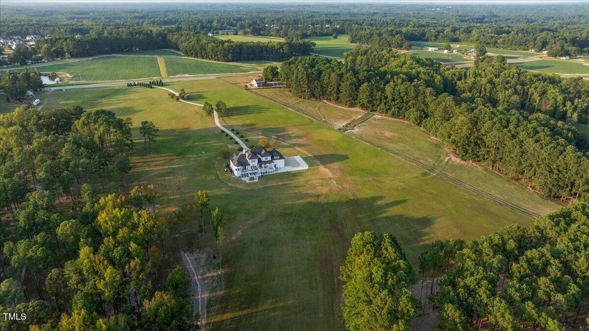 9816 Debnam Road Zebulon, NC 27597 - Photo 6 of 10 a view of a lake with a yard