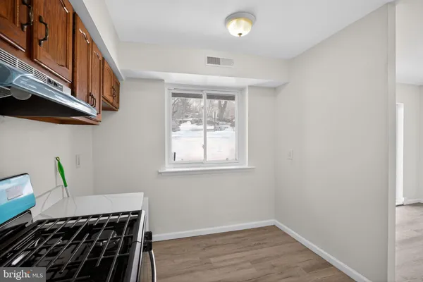 a kitchen with stainless steel appliances granite countertop a refrigerator sink and cabinets