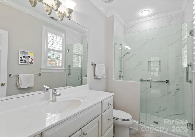 a bedroom with a bed chairs and window