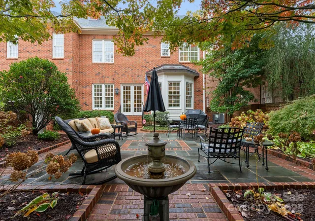 a front view of a house with patio and outdoor seating