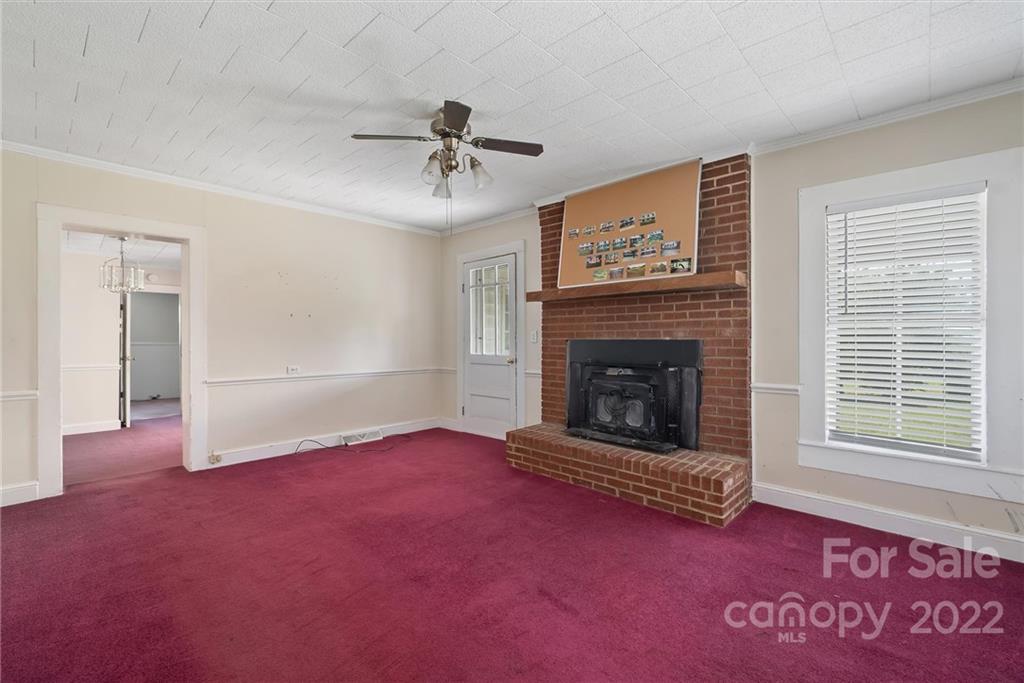 6700 Lineberger Road Sherrills Ford, NC 28673 - Photo 12 of 25 a living room with furniture and a fireplace