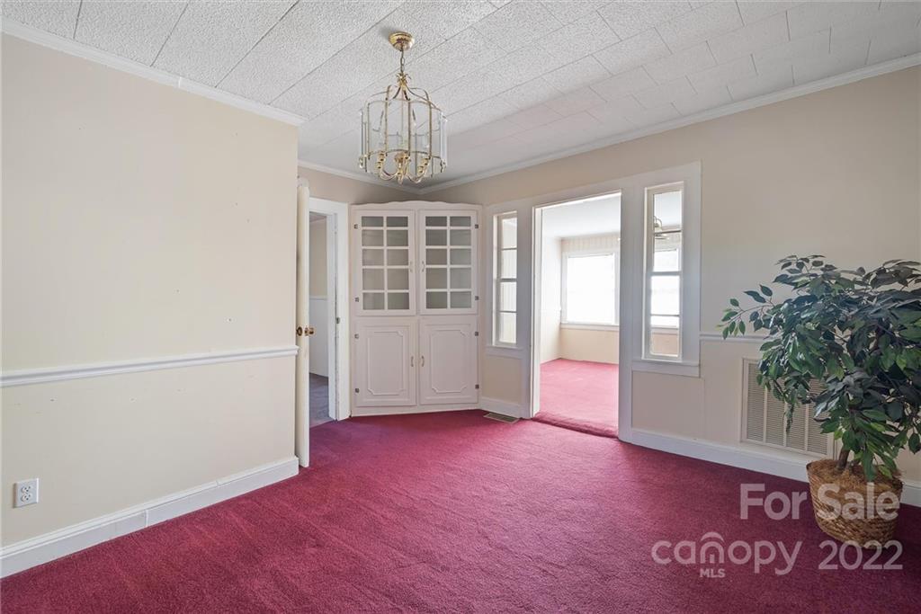 6700 Lineberger Road Sherrills Ford, NC 28673 - Photo 14 of 25 an empty room with windows and ceiling fan