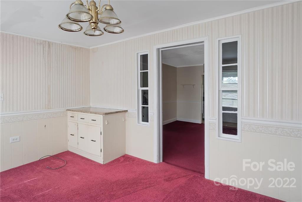 6700 Lineberger Road Sherrills Ford, NC 28673 - Photo 16 of 25 a bedroom with a bed and cabinets