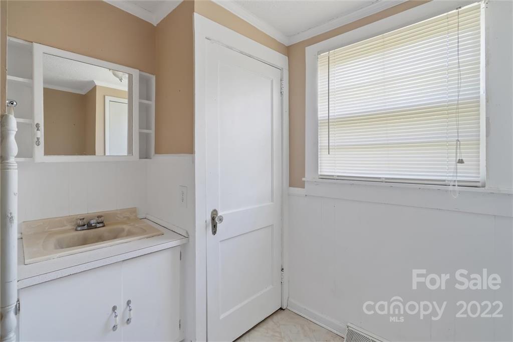 6700 Lineberger Road Sherrills Ford, NC 28673 - Photo 22 of 25 a bathroom with a sink and a mirror