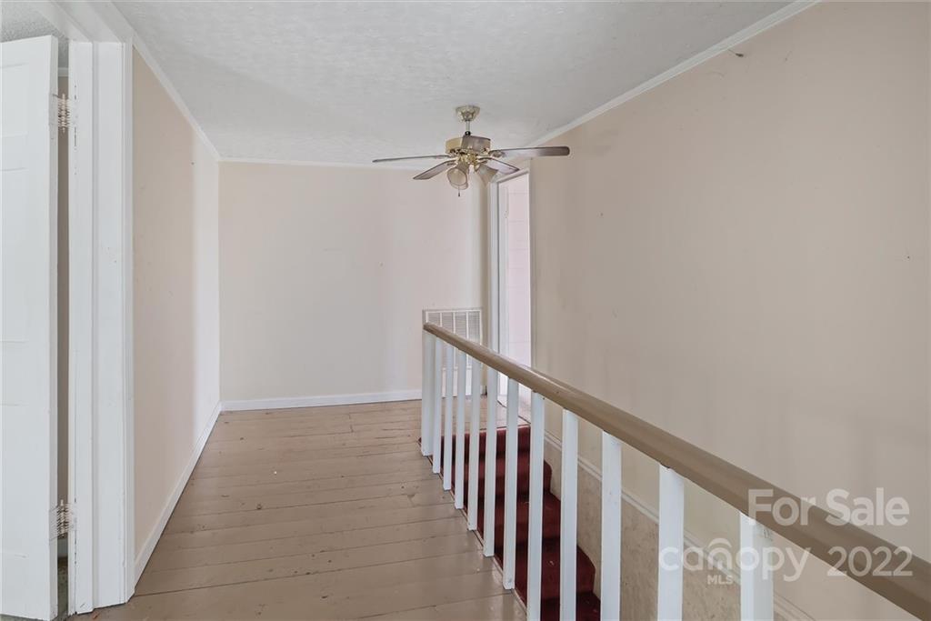 6700 Lineberger Road Sherrills Ford, NC 28673 - Photo 23 of 25 a view of a hallway with a chandelier fan