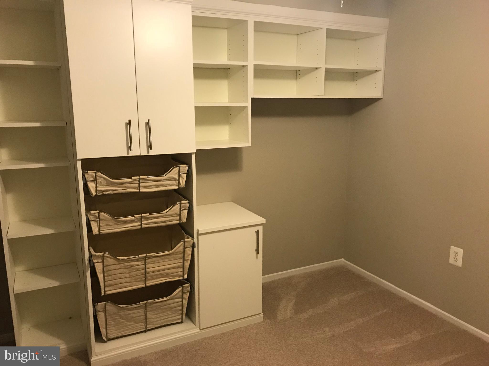 7702 Lexton Place, Unit 65 Springfield, VA 22152 - Photo 12 of 24 a view of walk in closet with empty racks