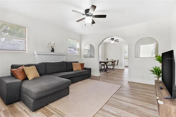a living room with furniture and a flat screen tv