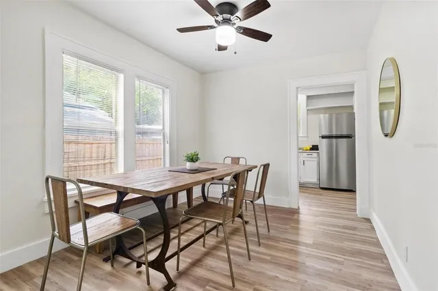 a view of a dining room with furniture and a window
