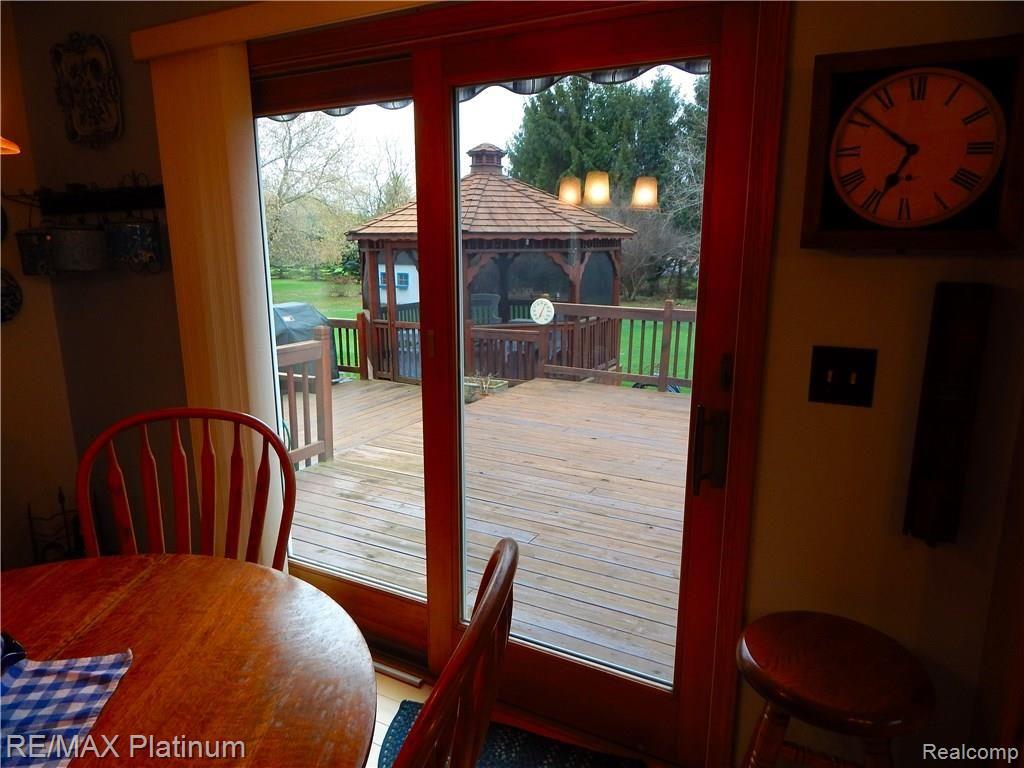 86 South Burkhart Road Howell, MI 48843 - Photo 15 of 52 Step through this Anderson Doorwall onto your Large Deck and into your Lovely Gazebo!