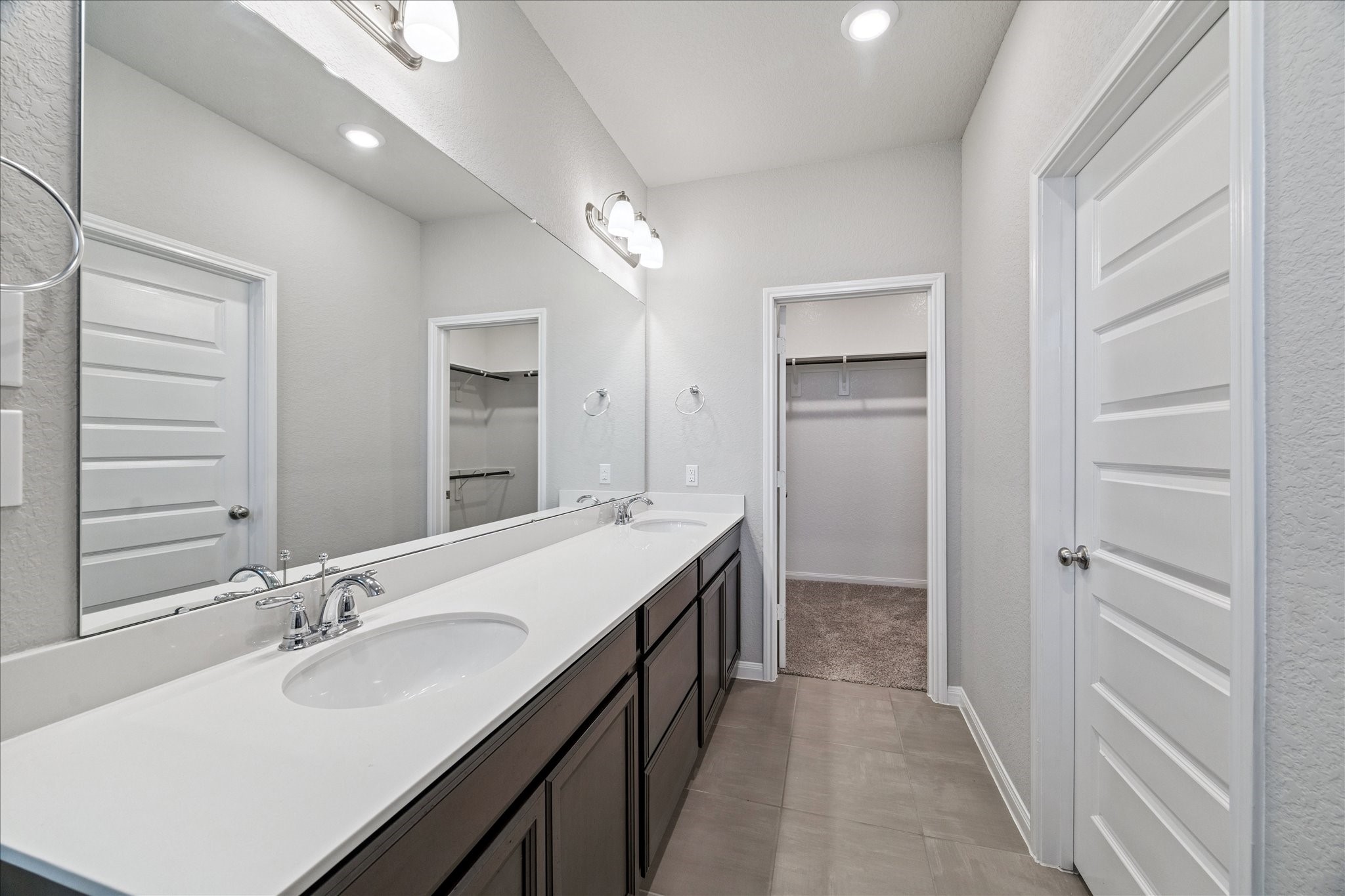 5502 Cuerta Street Houston, TX 77023 - Photo 18 of 25 Your guests will never want to leave! Double sinks and a plethora of storage space make this an ideal bathroom.