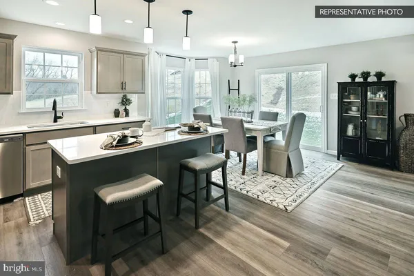 a view of a dining room with furniture and window