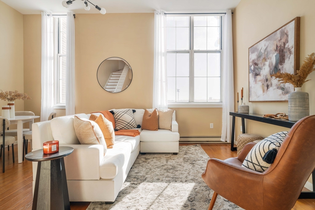 240 Heath Street, Unit PH16 Boston, MA 02130 - Photo 1 of 31 a living room with furniture and a window