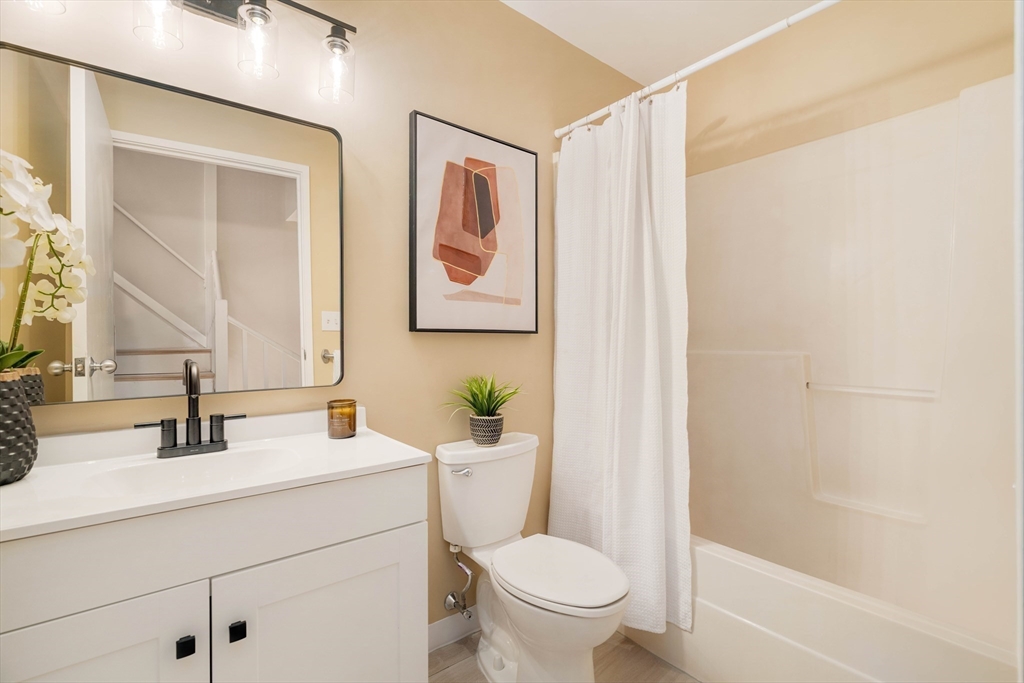 240 Heath Street, Unit PH16 Boston, MA 02130 - Photo 21 of 31 a bathroom with a sink a toilet and shower